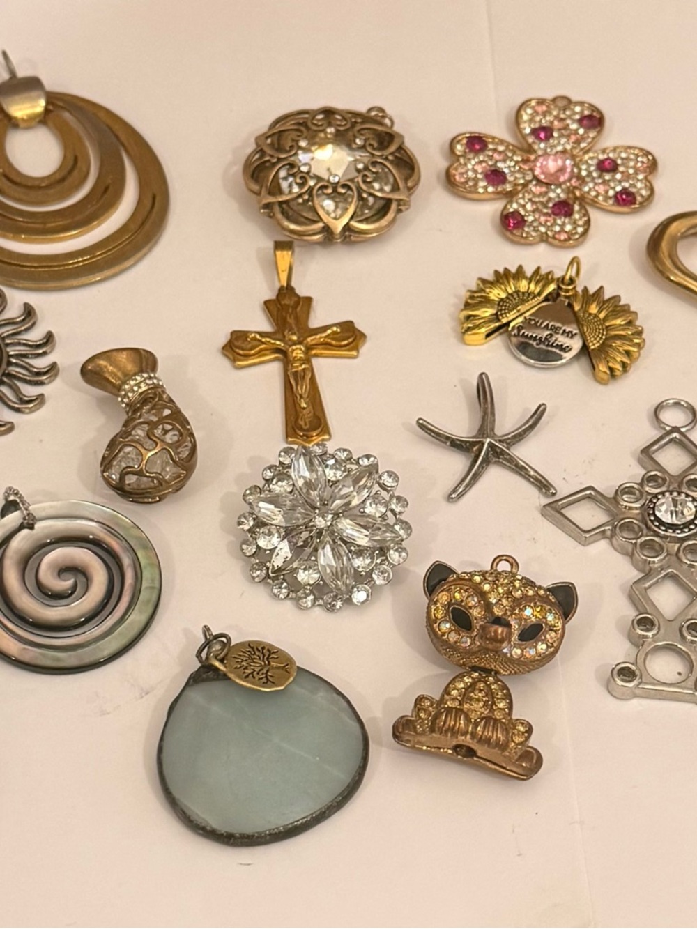 Vintage Pendants and Brooches Mix with Crystal glass and natural elements.
